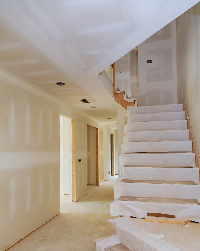 interior new home construction of housing project with drywall installed
