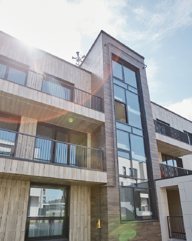 of modern apartment building with lens flare